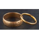 Two gold band rings, including an 18ct gold, Victorian band ring with engraved floral decoration,