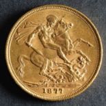 An 1877 Victorian Gold Sovereign of Melbourne Mint.