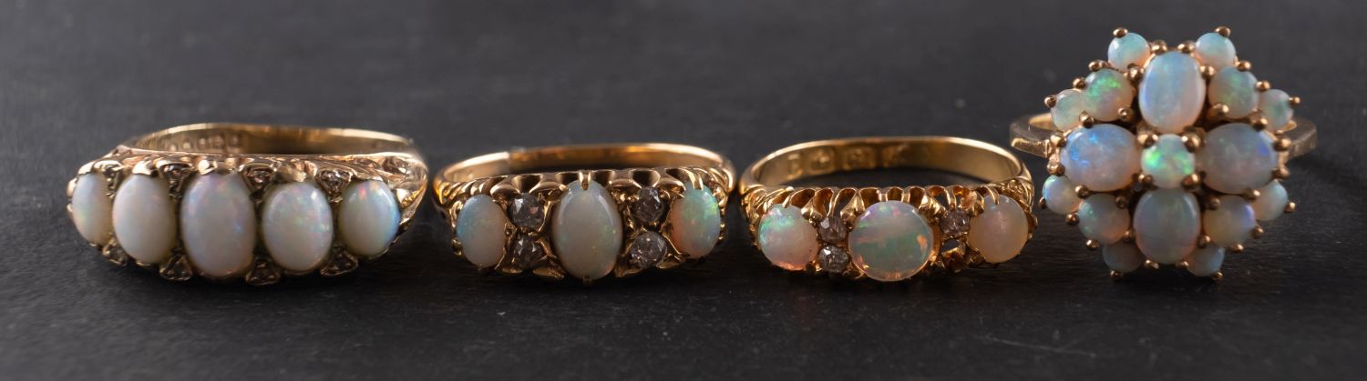 Four opal rings,