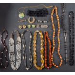 A small collection of jewellery including a citrine bead necklace; an amber bead necklace;