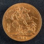 A George V gold sovereign coin, dated 1913, diameter ca. 22mms, total weight ca. 7.9gms.