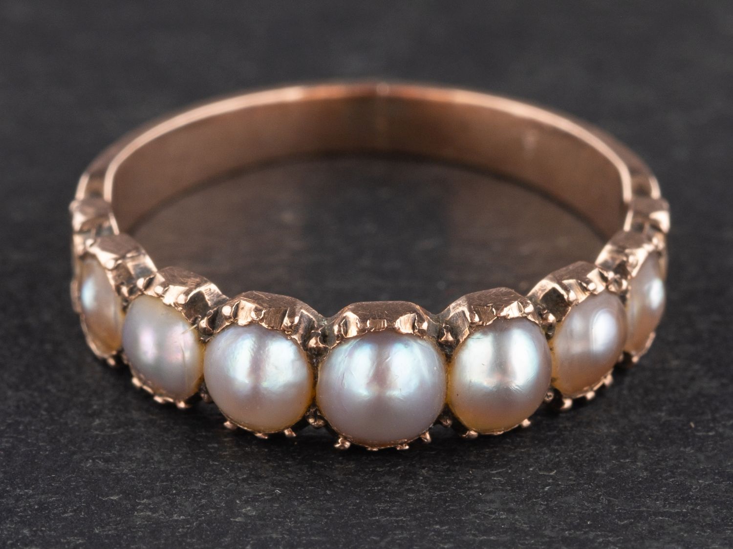 A 19th century, graduated, mabe pearl half-eternity ring, length of ring head ca. 1.