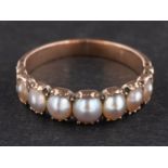 A 19th century, graduated, mabe pearl half-eternity ring, length of ring head ca. 1.
