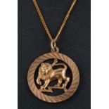 A 9ct gold pendant depicting a lion, representing the astrological sign of Leo,
