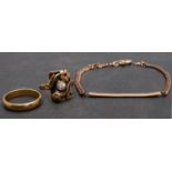 Two rings and a bracelet, including a ring with a white paste and floral decoration, stamped '585',