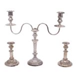 A 19th century Old Sheffield Plate twin branch candelabrum with gadrooned rims and reeded scroll