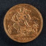 A George V gold sovereign coin, dated 1910, diameter ca. 22mms, total weight ca. 8gms.