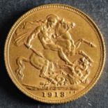 A 1913 Georgian Gold Sovereign.