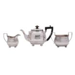 A George V three piece silver tea service, maker Frazer and Haws, London 1922, of barge form,
