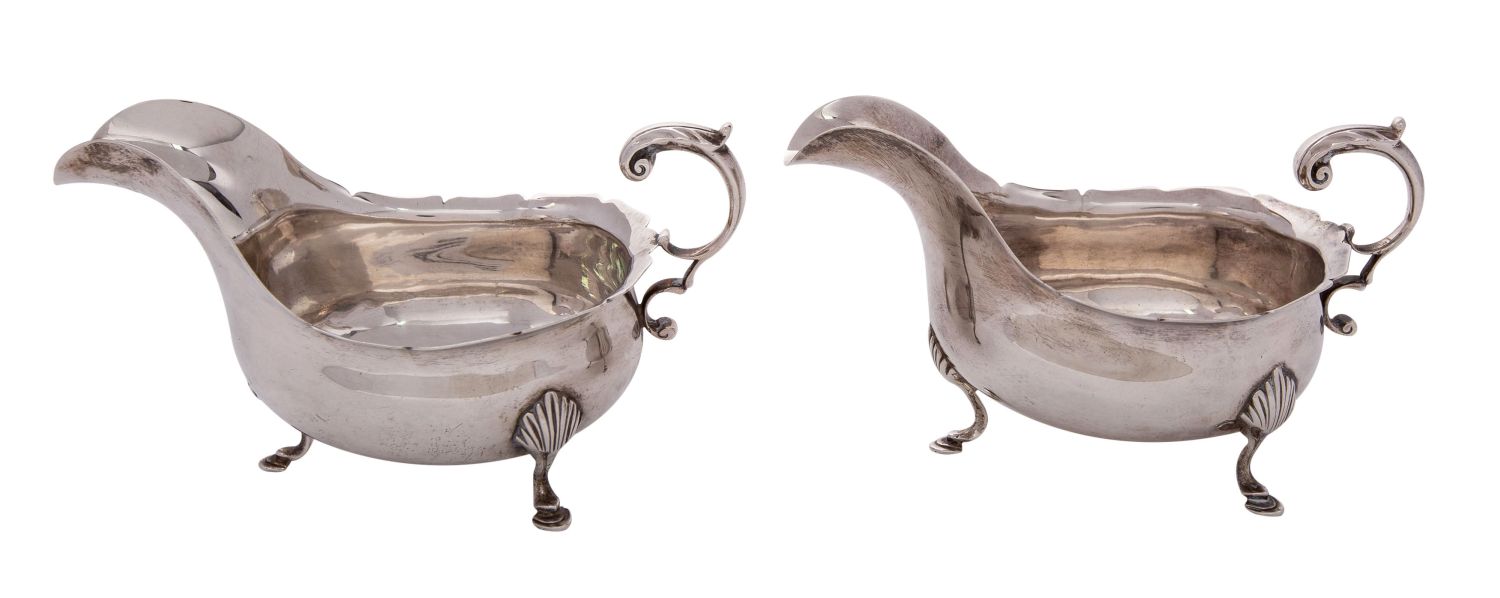 WITHDRAWN A pair of George III style silver sauce boats, maker Marcus Beaver Birmingham 1905,