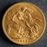 A 1913 Georgian Gold Sovereign.