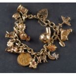 A 9ct gold, flattened, curb-link charm bracelet with heart-shaped clasp, with various charms,