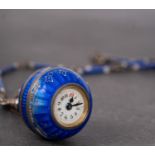 WITHDRAWN An Edwardian enamel and silver ball fob watch the small white dial with Arabic numerals