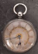 A silver pocket watch the silver dial with applied gold Roman numerals and decoration,