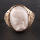 An imitation coral cameo ring, with engraving to shoulders, length of ring head ca. 1.