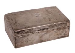 A George V silver cigarette casket, Birmingham 1919 with two division wood lining, 14cm long.