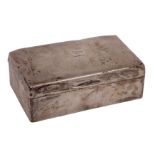 A George V silver cigarette casket, Birmingham 1919 with two division wood lining, 14cm long.