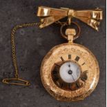 An 18ct gold half-hunter fob watch with gold bow,