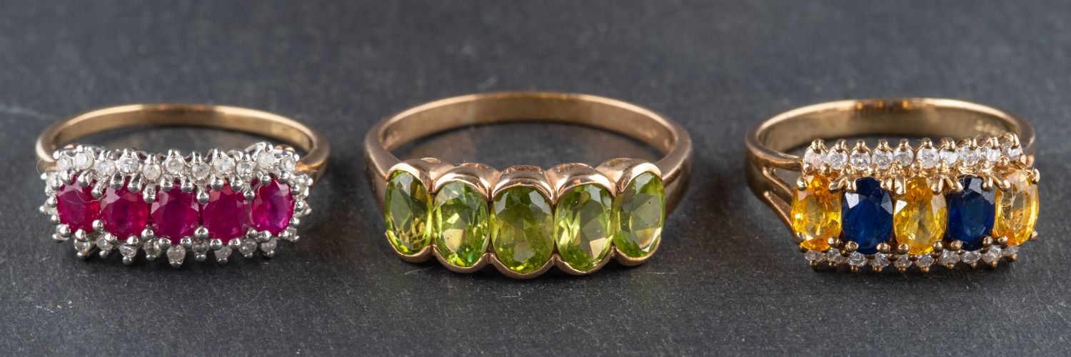 Three 9ct gold, gemset rings, including a peridot five stone ring, ring size T; a sapphire,