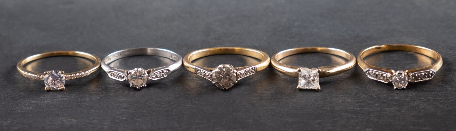 Five rings, including a princess-cut diamond ring, estimated diamond weight ca. 0.