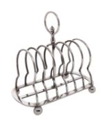 WITHDRAWN An Edward VII silver toast rack, maker Walker and Hall, Sheffield, 1905,