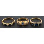 Three gemset rings, including an 18ct gold, sapphire and diamond half eternity ring,