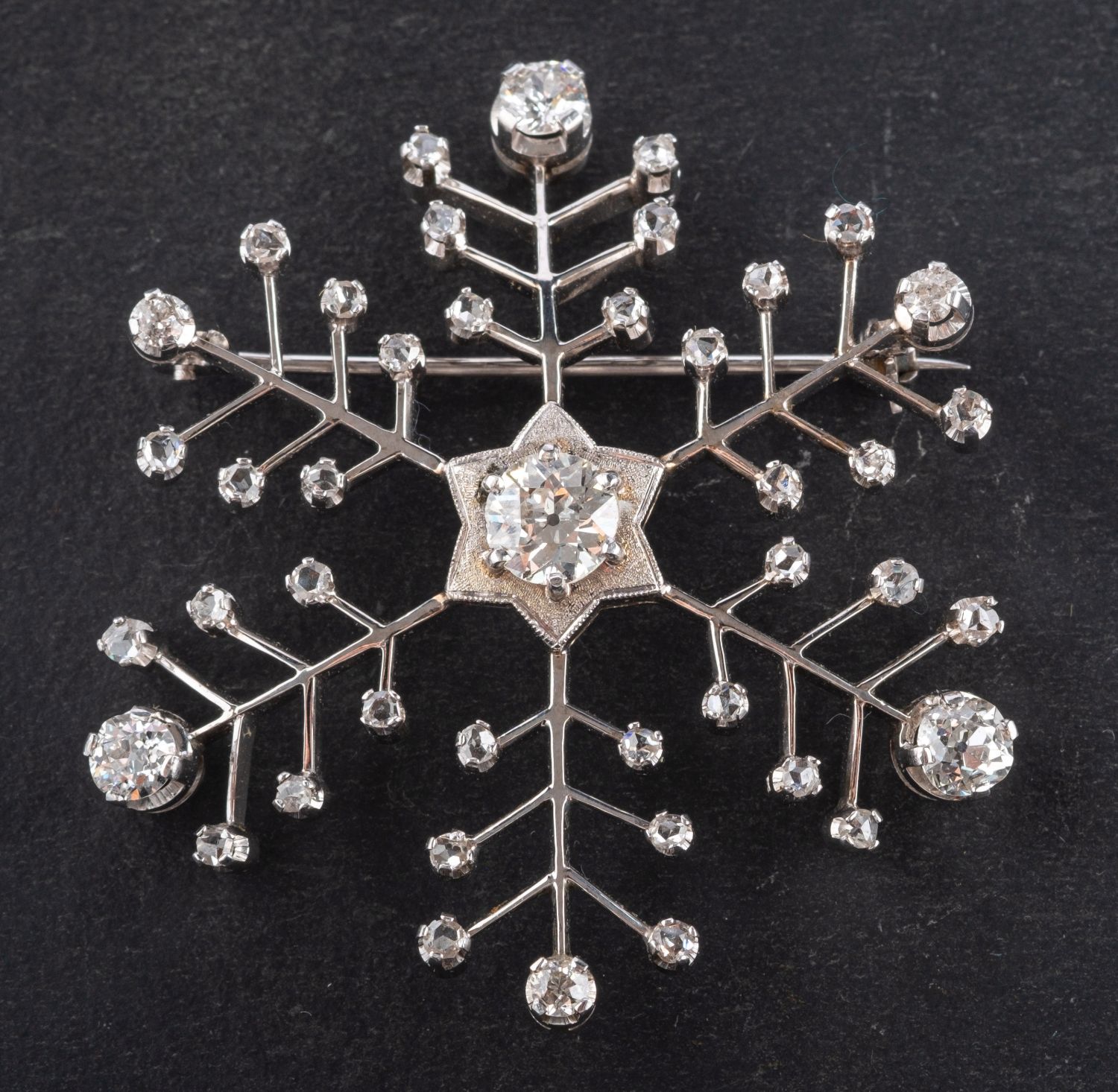 An old and rose-cut diamond, snowflake brooch, total estimated old-cut diamond weight ca. 1.