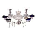 A pair of early 19th century silver plated salts, with pierced decoration and blue glass liners,