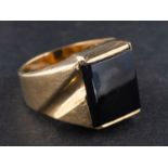 A rectangular onyx signet ring, stamped '14K, length of ring head ca. 1.