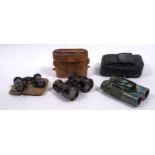 A pair of early 20th century leather cased binoculars,