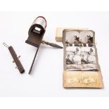 A Holmes pattern stereoscope viewer together with a set of 'The Battle- Field Series' stereoscope
