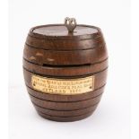 HMS Iron Duke. A teak barrel shaped money box and key, made from reclaimed ship's timbers.