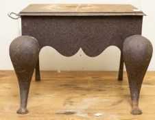 A 19th century iron and brass footstool: the rectangular top with handle to one side and cabriole