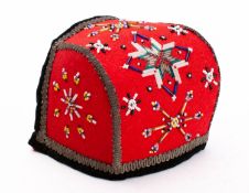 An early 20th century Scandinavian child's bonnet with traditional beaded decoration.