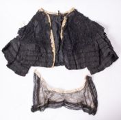 An early 20th century black lace and silk bolero style jacket,