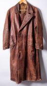 A WWII period brown leather trench coat, formerly belonging to Dr Reginald John Gilpin Navy.