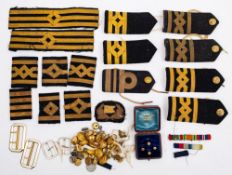 A collection of WWII and later Royal Navy buttons and epauletttes,