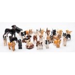 Beswick Dogs; A large collection of twenty-four models of various sizes.