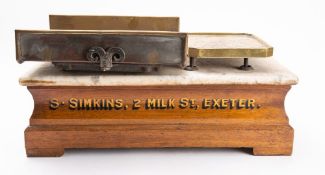A set of 'The 'Crown' counter top scales for 'S.Simkins, 2 Milk St, Exeter'.