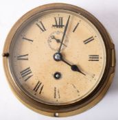 A brass bulkhead clock, with Roman numerals and subsidiary seconds dial,