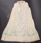 An early 20th century French 'flapper' style white cotton sleeveless dress with green and blue