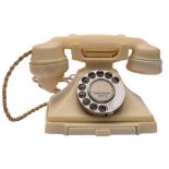 A GPO series 332 Ivory telephone with rotary dial and pull out tray,