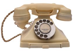 A GPO series 332 Ivory telephone with rotary dial and pull out tray,