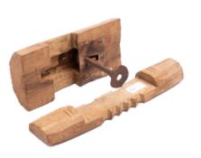 An early wood and iron lock and key: with wrought iron plate and wooden bar with five notches, 22.