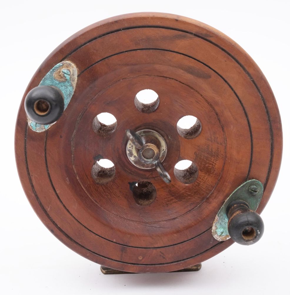 A late 19th century mahogany and brass star back reel, with double horn handles, - Image 6 of 6