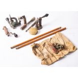 A group of three brass cartridge tools, unsigned, together with two brushes,