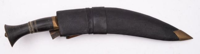 A late 20th century Kukri, of traditional form in a black leather scabbard, blade length 27cm.