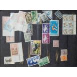 An accumulation of stamps and first day covers.