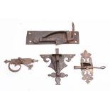 A group of four steel door latches,