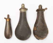 Two leather covered powder flasks with dram measure spouts and a smaller copper powder flask (3)